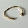 Gouden bangle glad